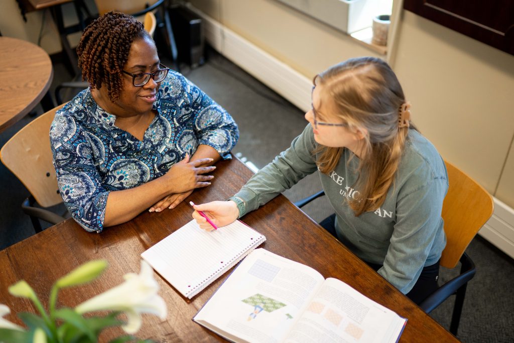 OLS staff member working with student